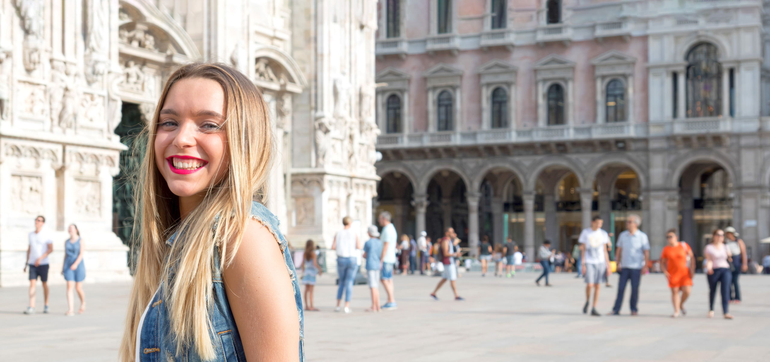 Pretty millennial teenager tourist visiting the city of Milan, in Italy